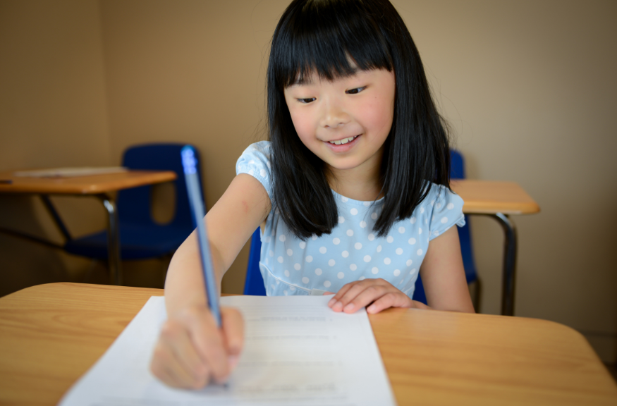 A photo of a young girl answering a best in class learning material